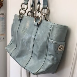 Coach handbag.  Light blue.  Silver rings and side trim.  Lots of pockets.